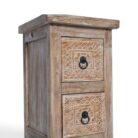 Hand-carved floral drawer panel with metal ring pull, detail