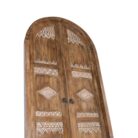 Metal ring handles on carved teak doors